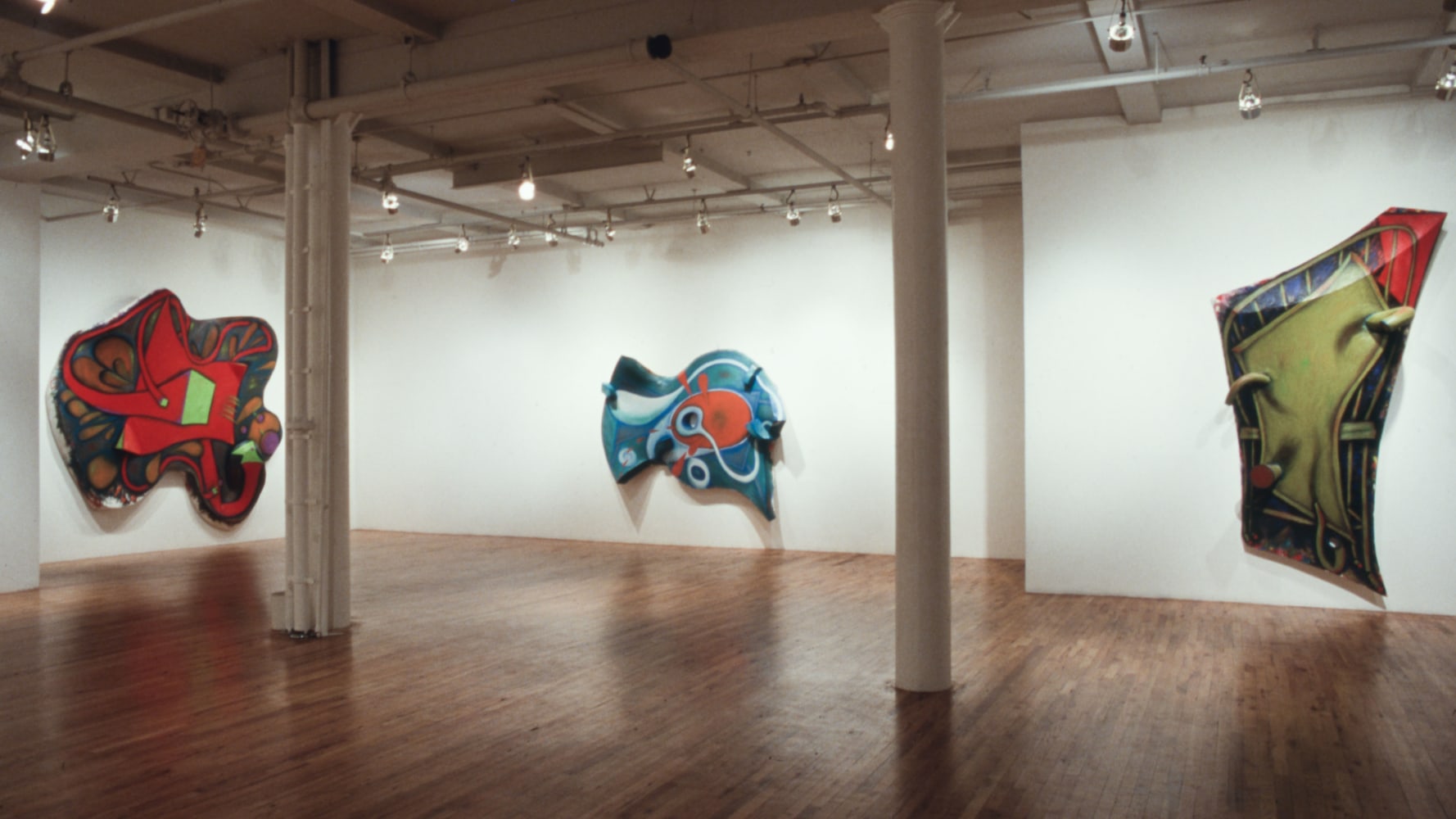 Installation view, Paintings and Drawings, Paula Cooper Gallery, 155 Wooster Street, New York, April 25 - May 23, 1987. © 2025 Elizabeth Murray / Artists Rights Society (ARS), New York. Courtesy Paula Cooper Gallery, New York. Photo: Geoffrey Clements.