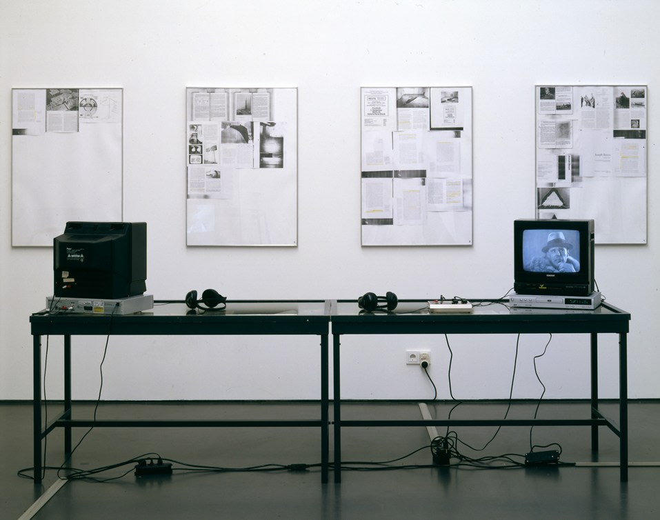 Sam Durant "Monologue and Dialogue" 2003 Vitrine, books, newspapers, moniters, DVD players, cables, memory man effect processor 49 x 11.25 x 28 in.