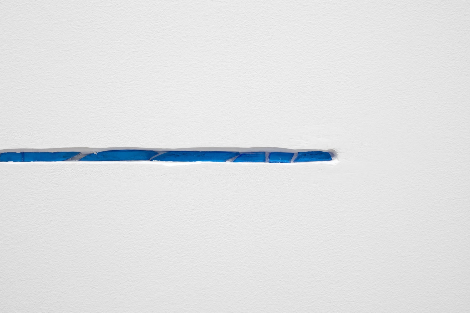 Wall Slit 2, (detail), 2017 Plexiglas, plaster, acrylic 1/2 x 26 x 1/2 in. (1.27 x 66 x 1.27 cm), 67 in.(170.2 cm) from the floor