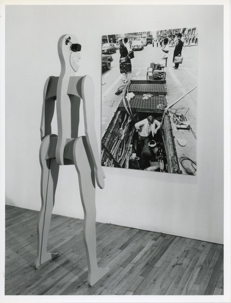 Jonathan Borofsky &quot;2,845,312 Chattering Man with Photograph&quot; 1983 New York Times Photo by Fred R. Conrad of NYC blackout, September 1983 66 x 48&quot; Man: Aluminum, wood, primer, Bondo, electric motor, speaker 92 1/2 x 23 x 13&quot;