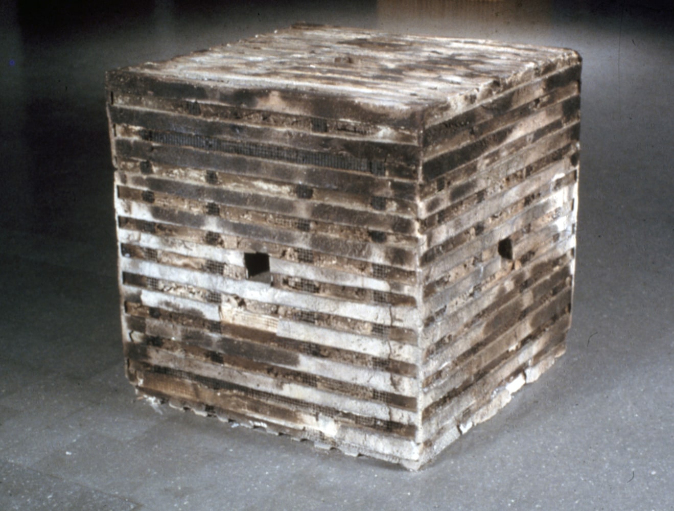 Jackie Winsor Burnt Piece, 1977-78 concrete, burnt wood, and wire 36 x 36 x 36 inches Collection of The Museum of Modern Art