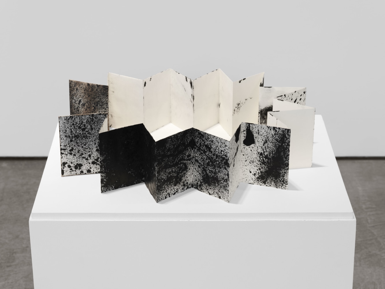 Bruce Conner UNFOLDING BOOK, 1993 black ink on paper mounted on paper, paper board front and back covers 4 7/8 x 3 5/8 x 1/4 in. (12.4 x 9.2 x .6 cm) unfolded 4 7/8 x 79 in.