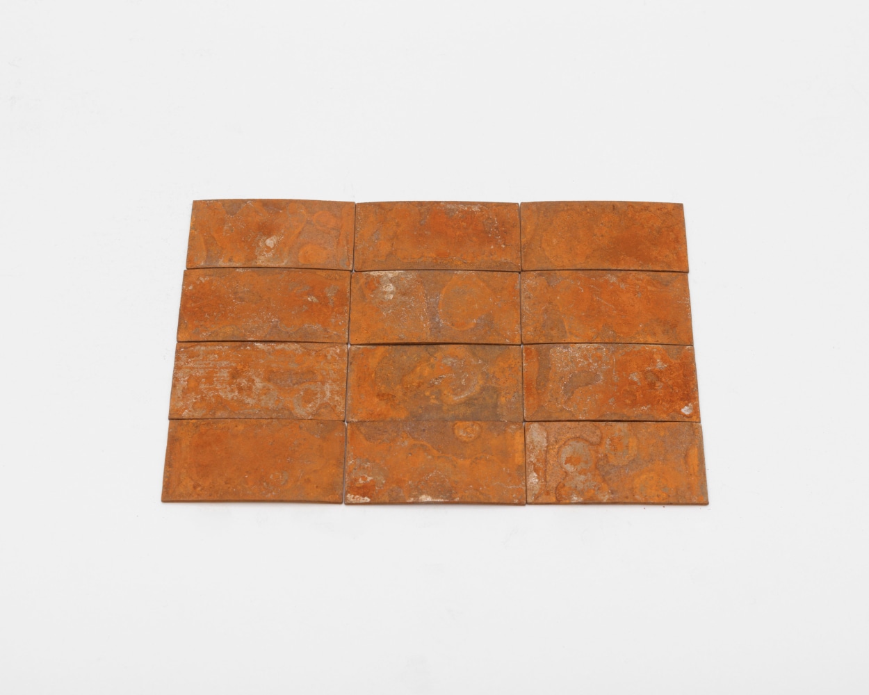 Carl Andre 12 (4 x 3) Rusty Steel Rectangle, 2014 steel each: 1/16 x 15/16 x 1 15/16 in. (.2 x 2.4 x 4.9 cm) overall: 1/16 x 3 7/8 x 5 3/4 in. (.2 x 9.8 x 14.6 cm)
