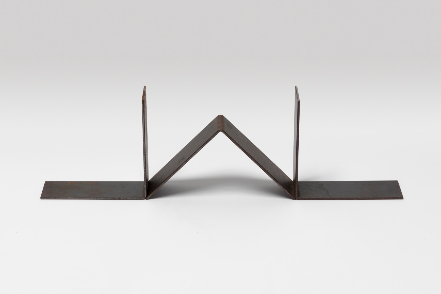 Carl Andre 
Three Part Steel Trip, 2019
3 Steel right angle units
6 x 6 x 2 3/8 in. (15.2 x 15.2 x 6 cm)
overall: 6 x 20 3/4 x 2 3/8 in. (15.2 x 52.7 x 6 cm)