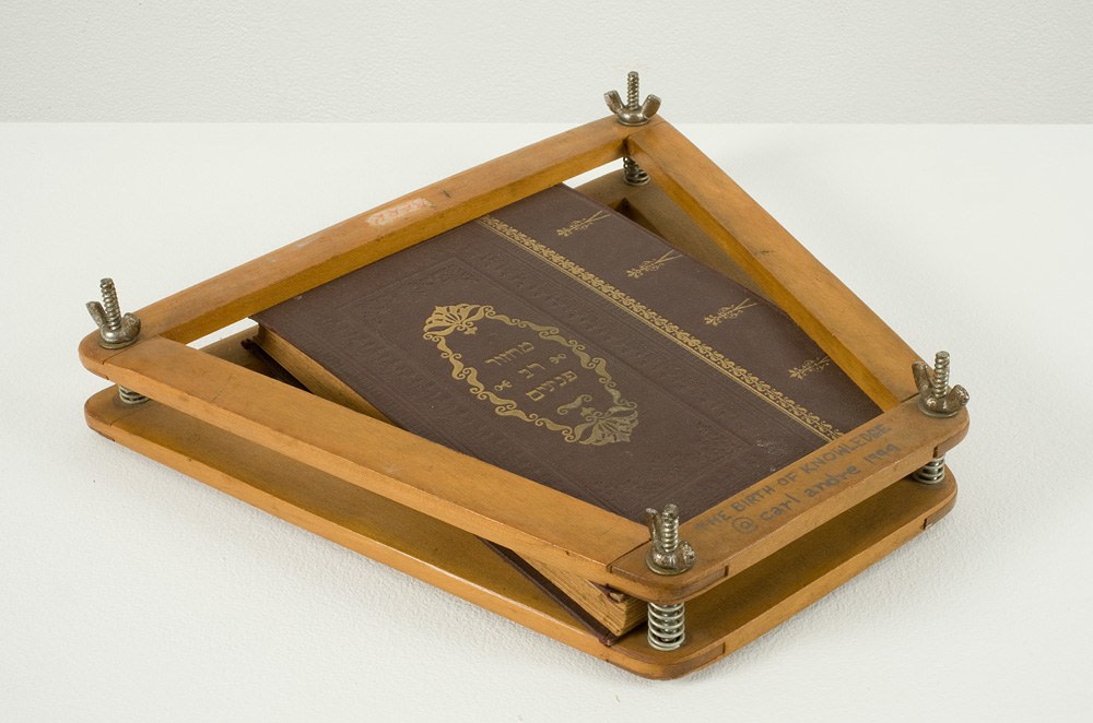 Carl Andre The birth of knowledge, 1994 wood tennis racket frame and leather bound book 10 1/4 x 11 1/4 x 1 3/4 inches (26.04 x 28.58 x 4.45 cm) on face of wood frame, titled and dated