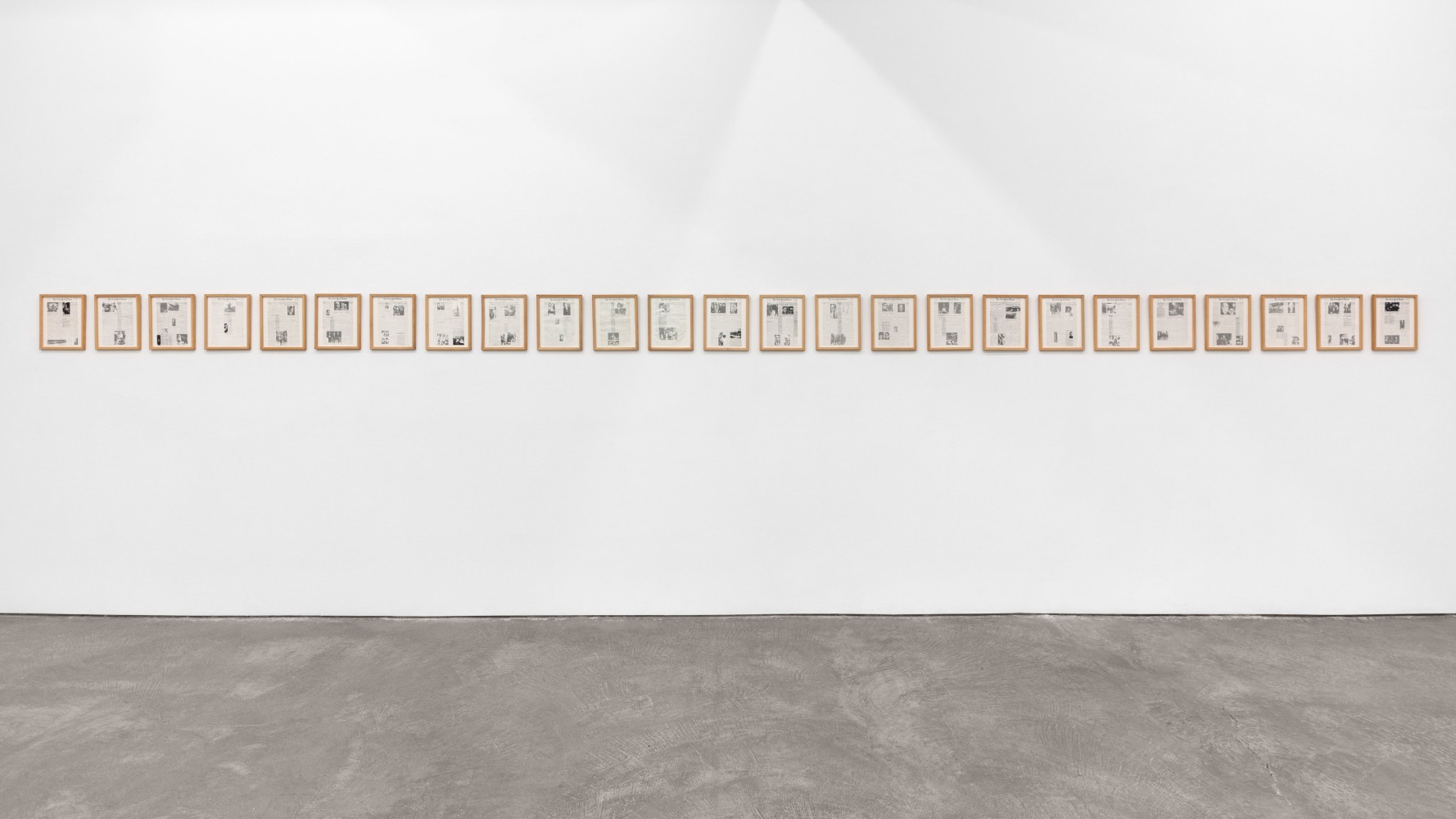 Installation view of Sarah Charlesworth's piece Historical Materialism: Chile Series (for O.L.), from 1976-1977. 25 photostat prints.