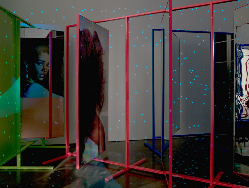Kelley Walker "Whitney Houston" 1984-85, 2008 aluminum stands, mylar, mirror,Epson prints , disco ball with chain, sound and video projection. dimensions variable