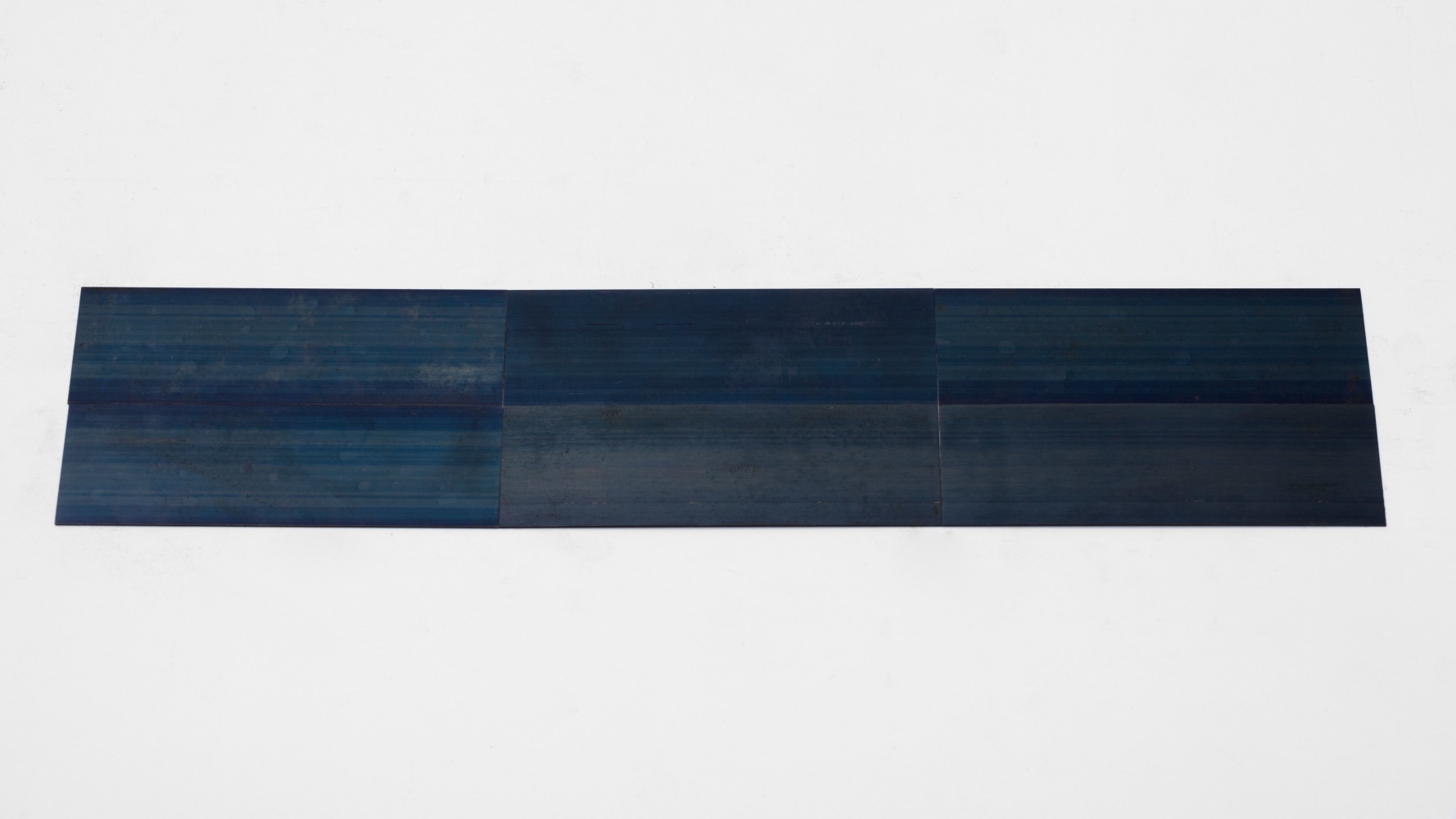 Carl Andre 6 Blue Steel Rectangle, 2014 blue steel 6 elements, each: 1/32 x 5 7/8 x 2 in. (.1 x 14.9 x 5.1 cm) overall: 1/32 x 17 1/2 x 4 in. (.1 x 44.5 x 10.2 cm)