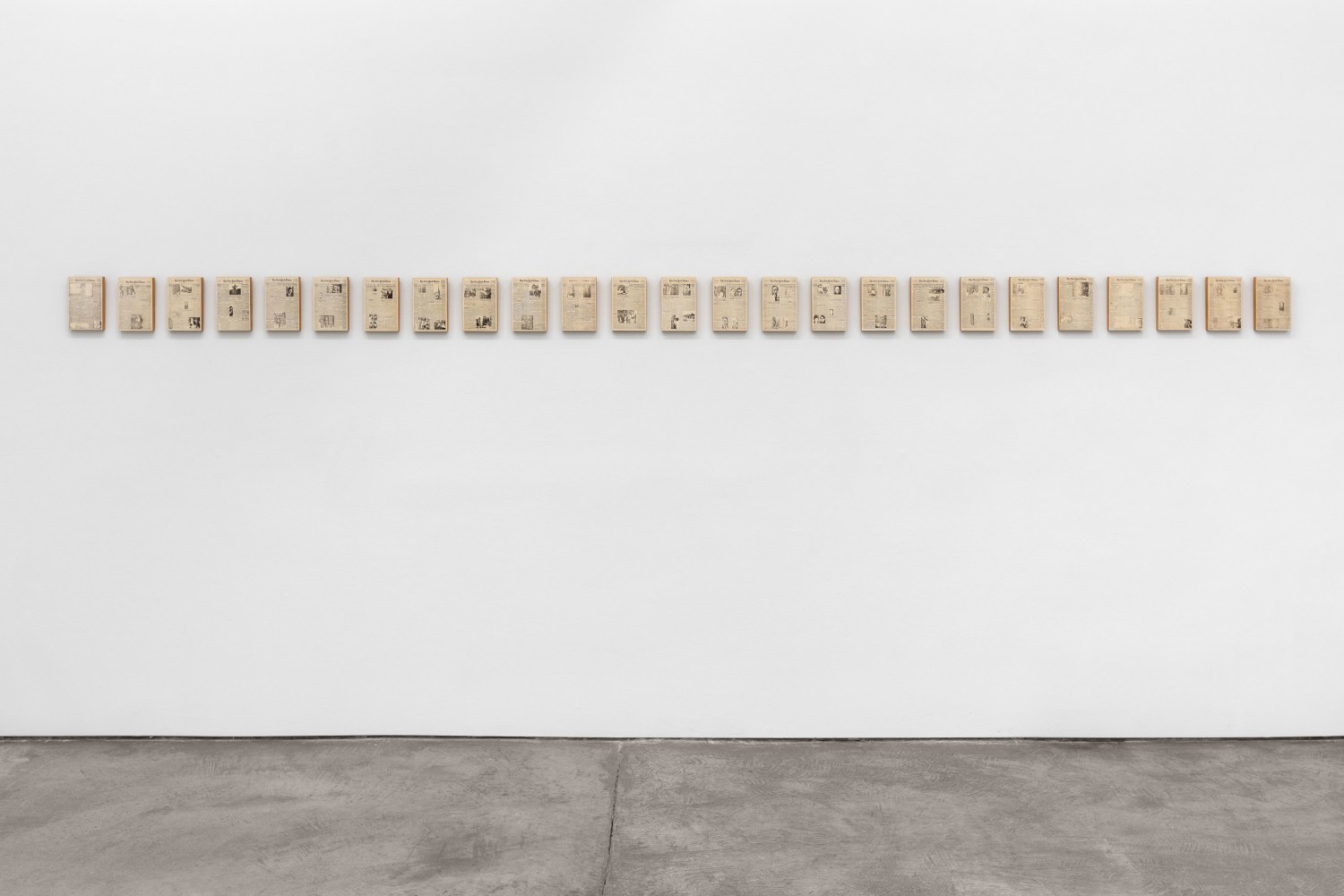 Installation view of Sarah Charlesworth's piece Historical Materialism: Chile Series (for O.L.) (Trial Proof), 1976-1977. 25 photostat prints mounted on wood panel