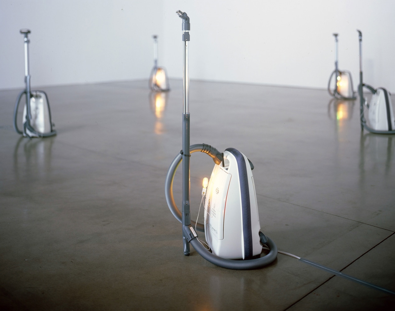 Céleste Boursier-Mougenot harmonichaos 2.1, 2006 13 vacuum cleaners, each outfitted with one tuner, one harmonica and one lightbulb overall dimensions variable; dimensions of one vacuum cleaner: 49 x 18 x 17 inches