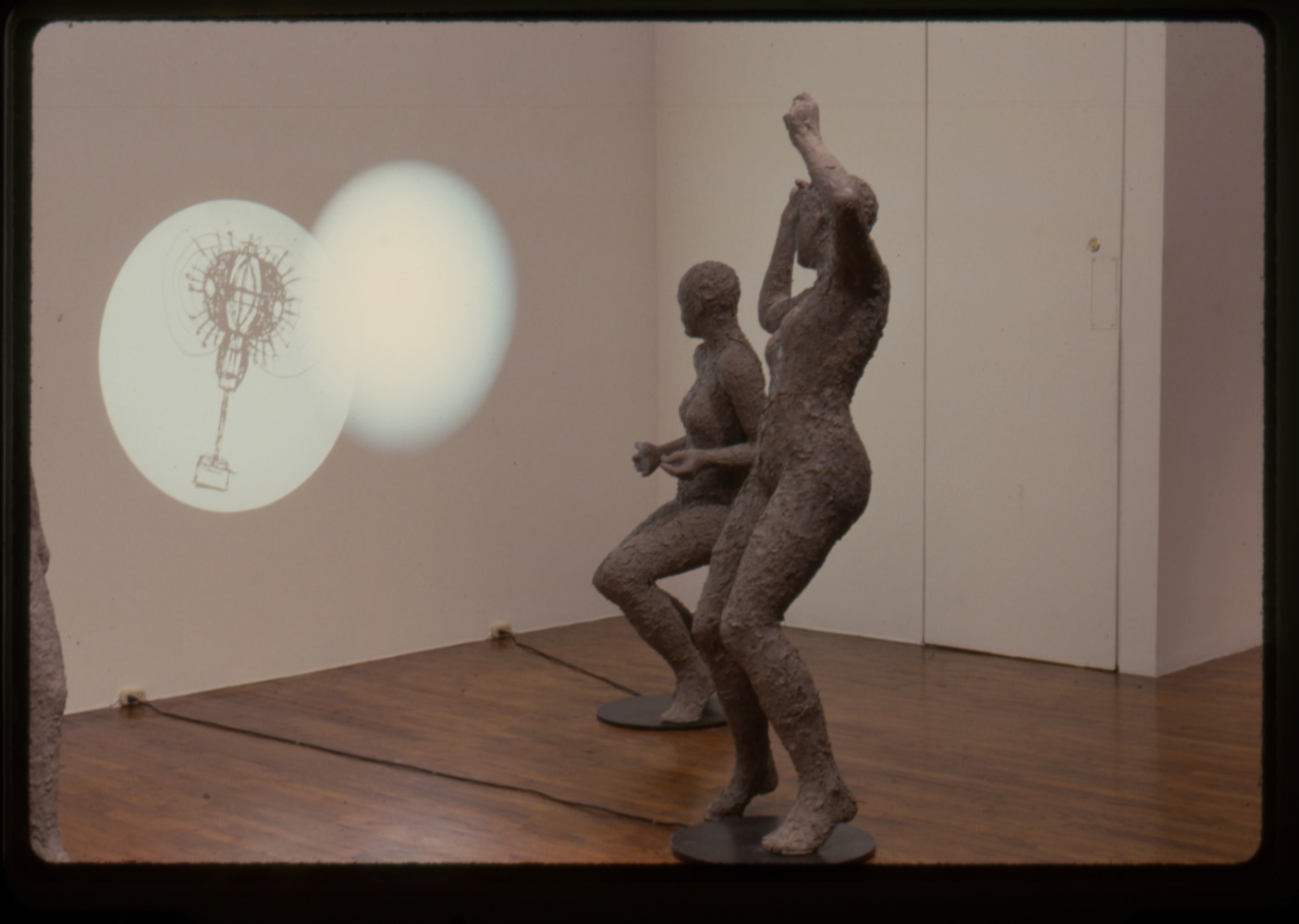 Jonathan Borofsky &quot;Projectors No. 3,214,873&quot; 1989-90 Fiberglass, celluclay, resin, projector, steel, and wood 73&quot; x 38&quot; and 58&quot; x 29 1/2&quot;