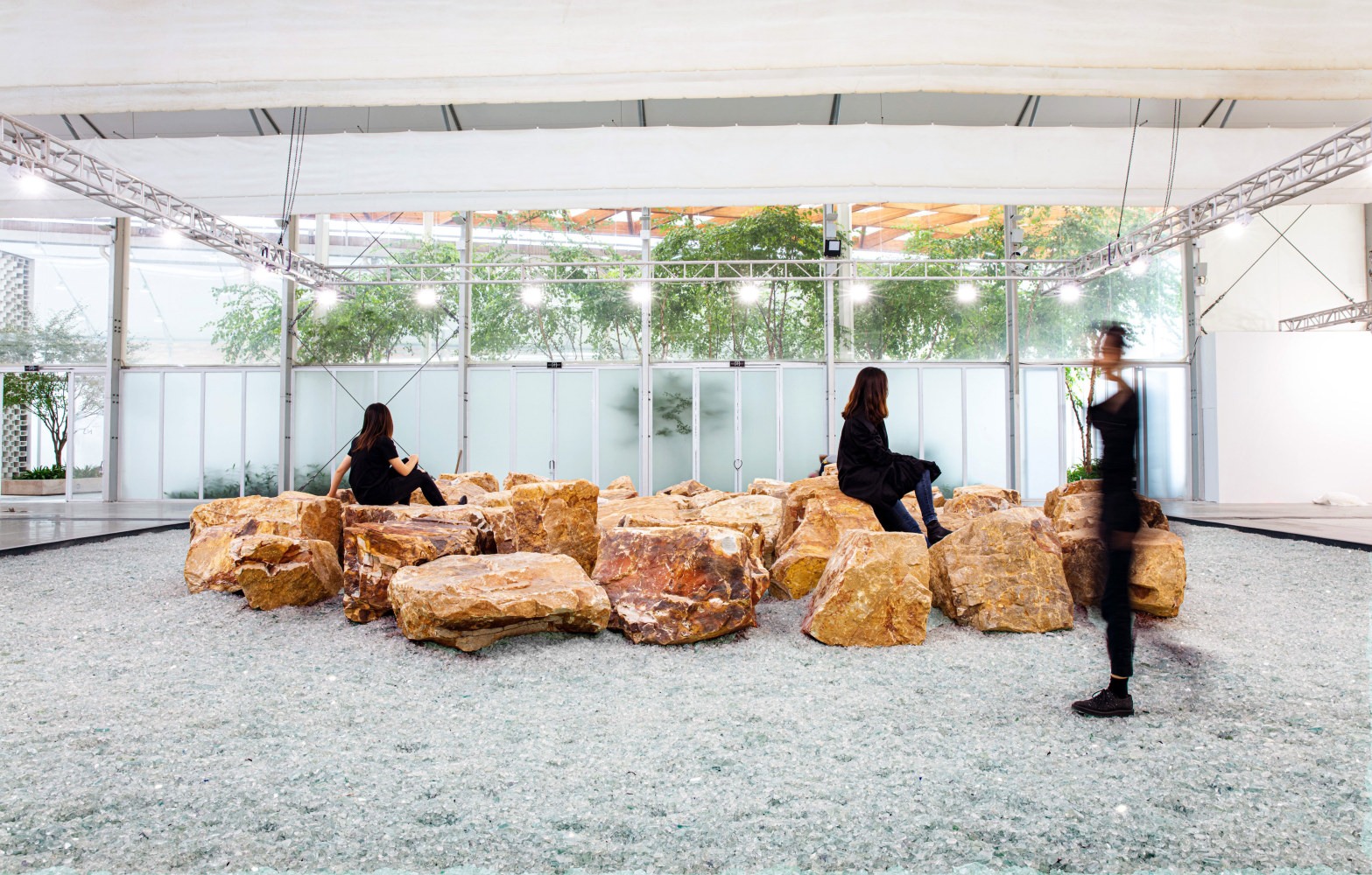 Céleste Boursier-Mougenot miner(e)ality, 2020 crushed recycled glass, 59 boulders, custom wood frame 14 x 14 m (46 x 46 feet) Installation view, West Bund Art &amp; Design, Shanghai, Xiàn Chăng Section, Booth B316 November 12 – 15, 2020. Photo: Lawrence Lu.