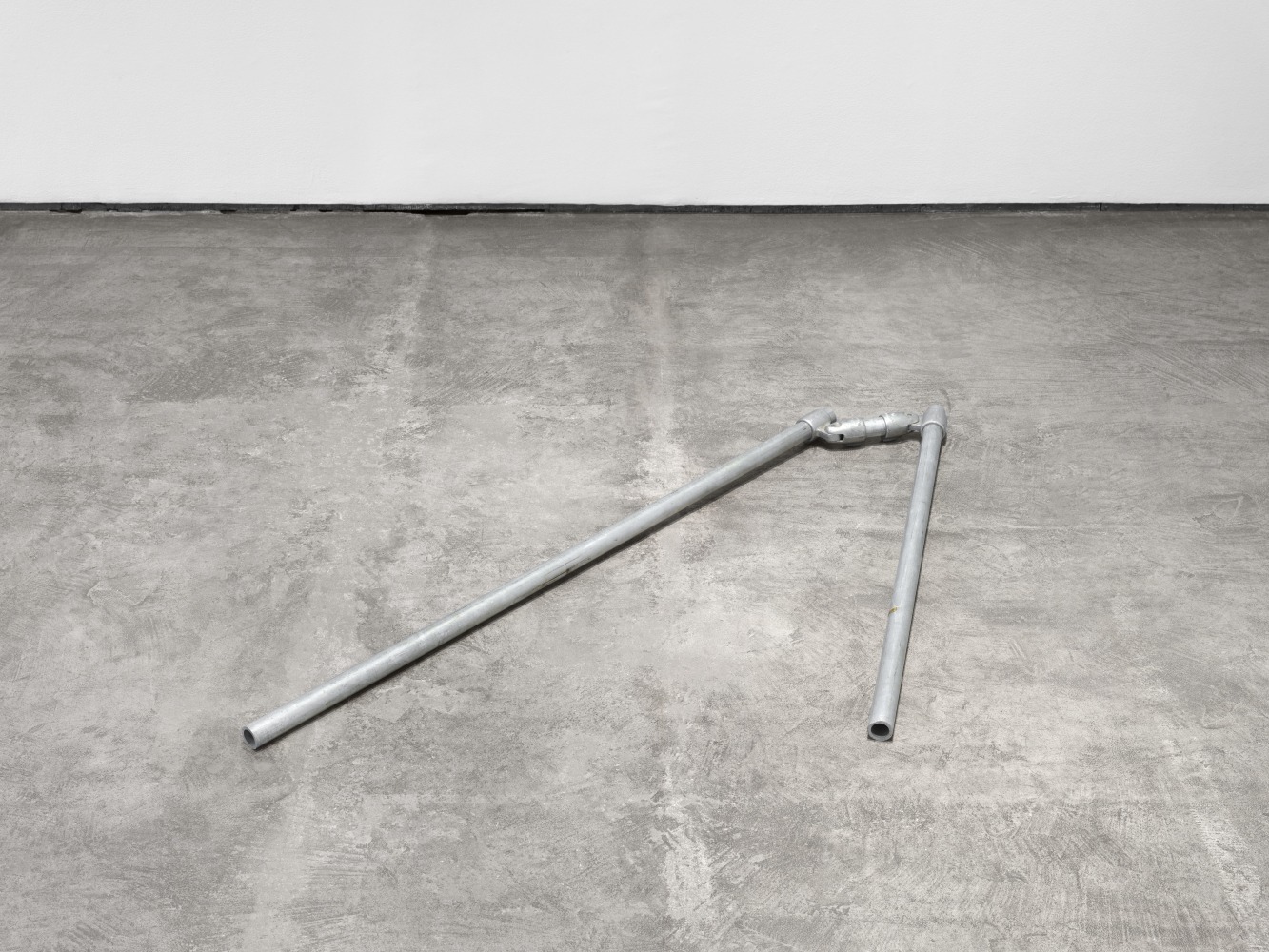 Bill Bollinger Untitled, 1964 aluminum pipes and pipe joint 1 pipe @ 1 1/4 x 48 in. (3.2 x 121.9 cm) 1 pipe @ 1 1/4 x 36 in. (3.2 x 91.4 cm) pipe joint: 2 x 10 3/4 x 2 in. (5.1 x 27.3 x 5.1 cm) overall dimensions variable