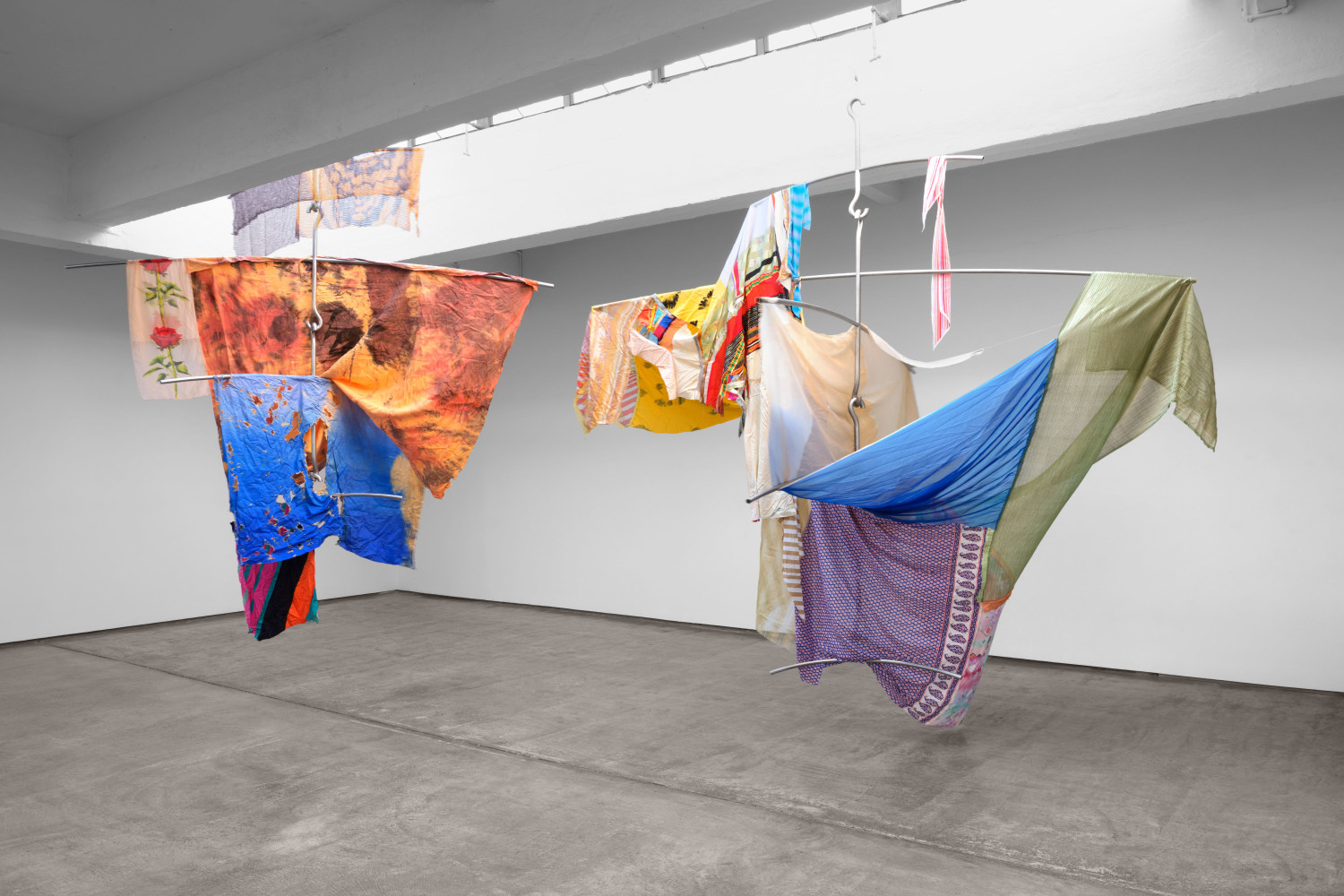 Eric N. Mack
Flourish, 2023
assorted fabric, steel
mobile 1: 120 1/2 x 130 3/4 x 130 3/4 in. (306.1 x 332 x 332 cm)
mobile 2: 144 1/2 x 141 3/4 x 141 3/4 in. (367 x 360 x 360 cm)