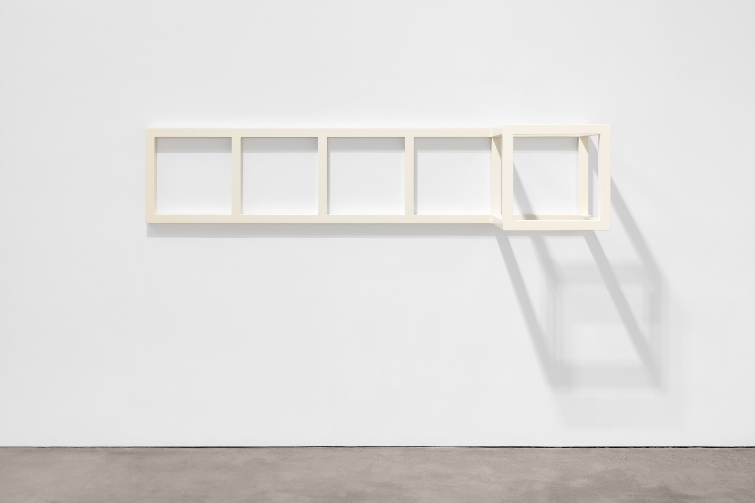 Sol LeWitt, Modular Wall Piece with Cube, 1965, remade 1977, white-painted wood, 21 x 96 x 21 in. (53.5 x 244 x 53.5 cm)
