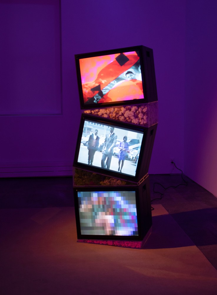 Ja'Tovia, Gary Precious Memories (Tower), 2020, HD and SD video from 16mm film on 3 CRT monitors, acrylic, dried cotton, moss, dried Helichrysum, monitors:  90 x 24 1/4 x 18 1/2 in. (2286 x 61.6 x 47 cm)