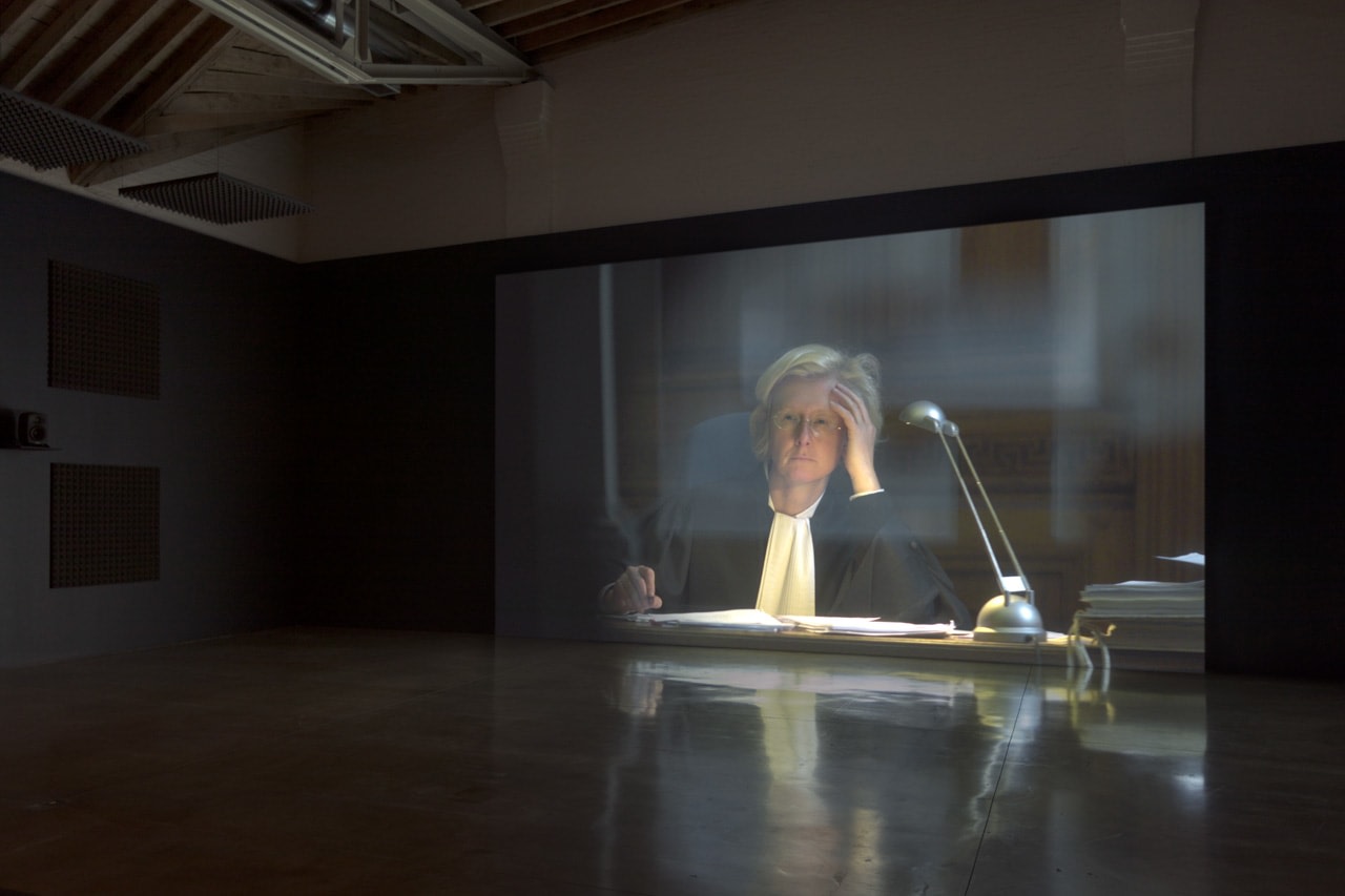 Palais de Justice, 2017, single-channel video, color, 5.1 surround sound, running time: 17:53 (approx.), Edition of 5, 2 APs. Installation view, Carey Young: Palais de Justice, Paula Cooper Gallery, September 7 – October 14, 2017
