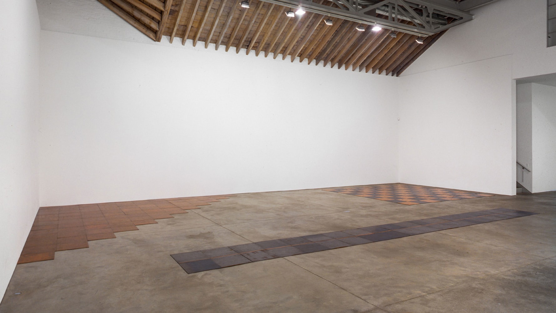 Installation view, Prospective Retrospective, Paula Cooper Gallery, 534 W 21st Street, New York, © 2025 Carl Andre / Artists Rights Society (ARS), New York. Courtesy Paula Cooper Gallery, New York. Photo: Adam Reich.