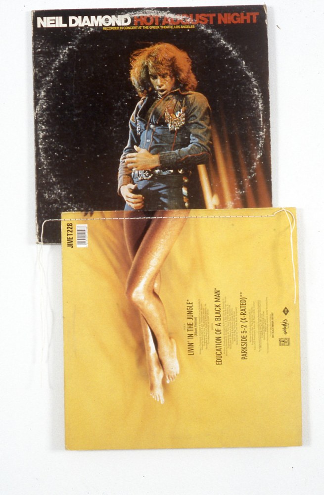 Christian Marclay "Hot August Night (from the series 'Body Mix')" 1991 2 record covers and cotton thread 23 x 13 3/4 in.