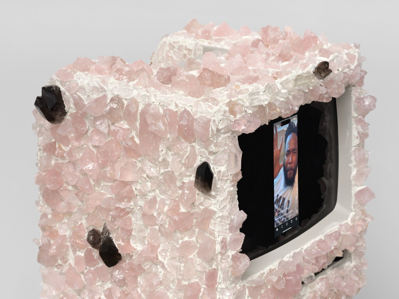 Ja'Tovia Gary Nice Nasty, 2024 Macintosh M0001 computer monitor, rose quartz, smoky quartz, clear quartz crystals, digital video, stereo sound computer monitor: 13 5/8 x 9 5/8 x 10 7/8 in. (34.6 x 24.4 x 27.6 cm)
