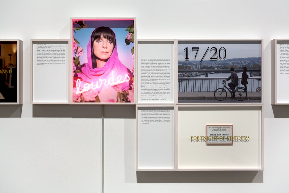 Sophie Calle Where and when? Lourdes / Où et quand? Lourdes (detail), 2005/2008 15 texts, 17 photos, 1 lenticular print, 1 shelf, 5 porcelain candle holders, 68 marble plates on steel frame 14 1/4 in. x 31 ft. 2 3/8 in. (36.2 cm x 9 m 51 cm) or 43 1/4 in. x 15 ft. 8 3/8 in. (109.9 cm x 4 m 78.5 cm) overall, depending on the installation framed photographs: 14 5/16 x 19 in. (36.3 x 48.4 cm) framed texts: 14 5/16 x 8 3/4 in. (36.3 x 22.2 cm) marble plates: 5 7/8 x 7 5/8 in. (15 x 20 cm) to 9 13/16 x 11 13/16 in. (25 x 30 cm), dimensions variable steel frame: 55 1/8 x 96 7/8 in. (140 x 246 cm)  Edition 2 of 5 (English) Edition of 5 English + 1 AP, Edition of 5 French + 1 AP