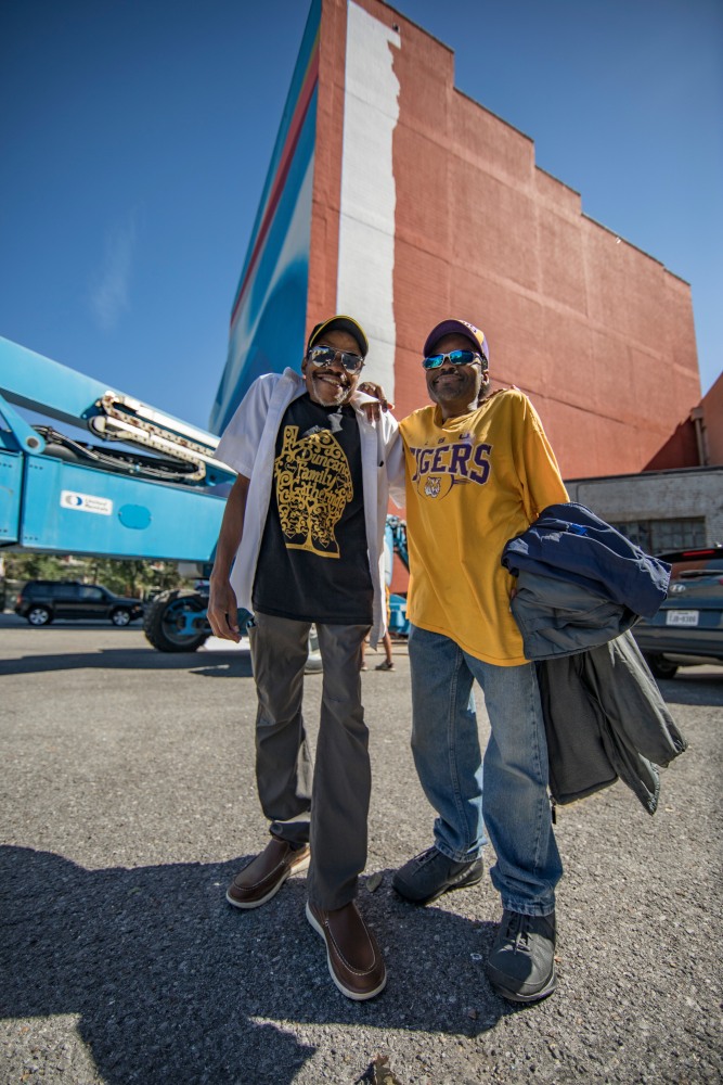 Artist Keith Duncan and his brother Karl stand in front of Keith&amp;#39;s &amp;quot;Drum Major of NOLA&amp;quot; mural in progress at The Ogden Museum of Southern Art.
Photo by: Crista Rock