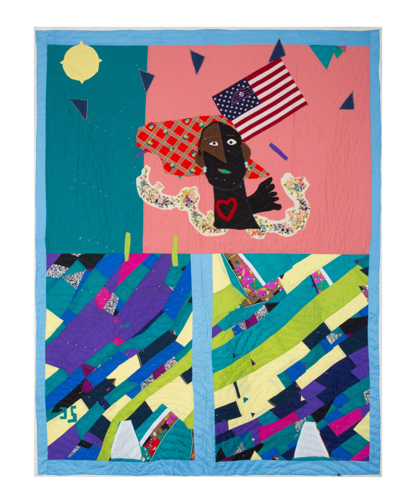 Blue-hued assorted fabric quilt with a figure holding a flag