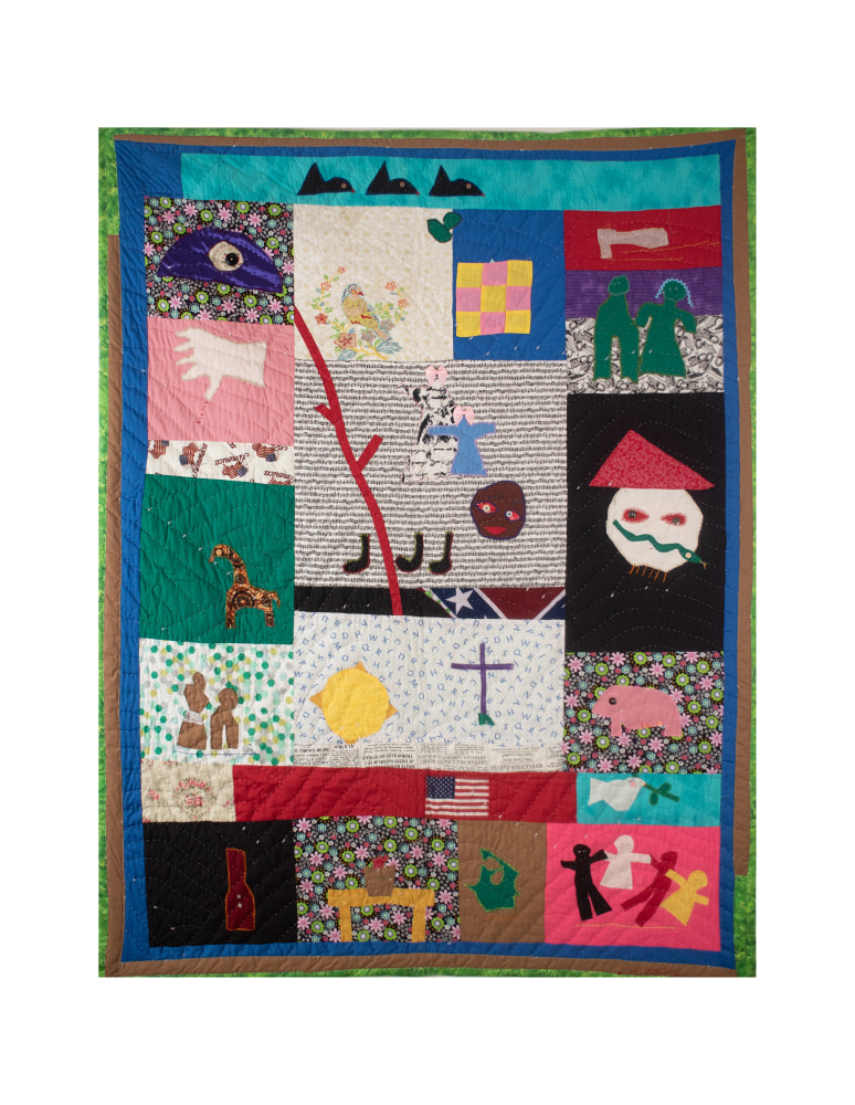 Colorful assorted fabric quilt with various figures depicted on each fabric square