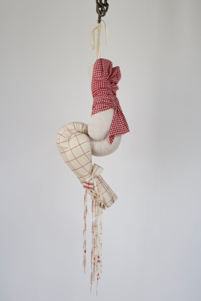 Banter, 2018
2 boxing gloves, vintage linen, chain
35 x 9.5&amp;nbsp;x 7 inches
