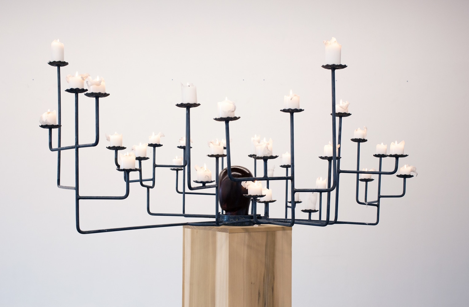 Shackle and Light, 2019
Steel, candles, and flame
37 1/2 x 78 x 69 inches