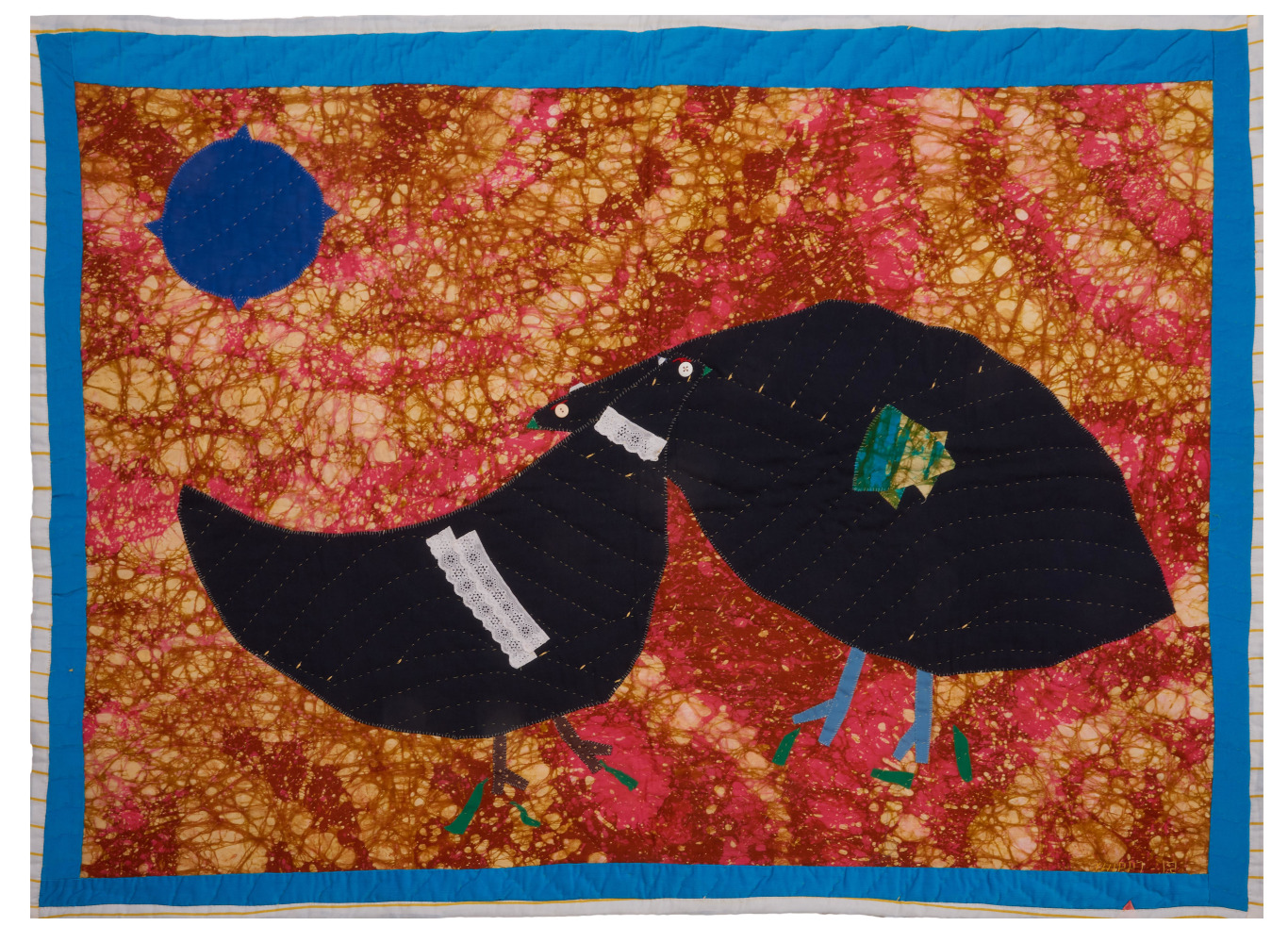 A quilt of two identical chickens embracing