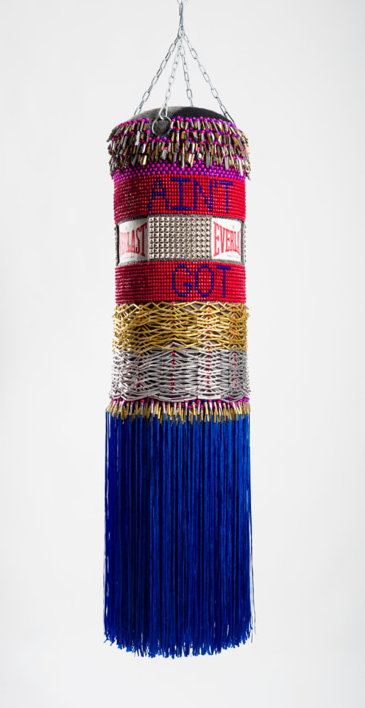 Jeffrey Gibson
Ain&amp;rsquo;t Got No, I Got Life, 2014
Found Vinyl punching bag, repurposed wool army blanket, glassbeads, plastic beads, steel studs, acrylic yarn, artificial sinew, nylonfringe, metal cones, quartz, crystals, steel chain
55 x 15 x 15 inches
Collection of Tracy High &amp;amp; Roman Johnson, Courtesy of Marc StrausGallery, New York