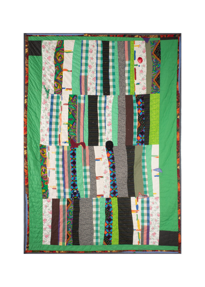 Green hued assorted fabric quilt