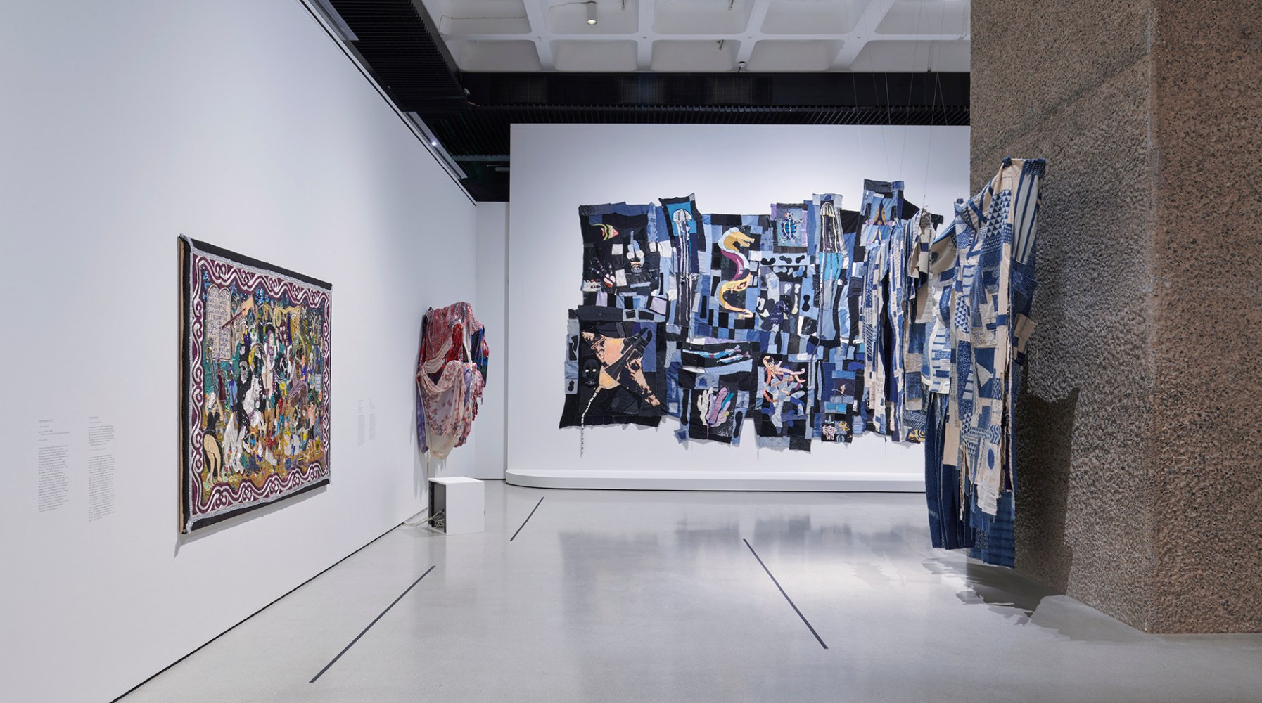 Installation view at Barbican Art Gallery with four textile art works