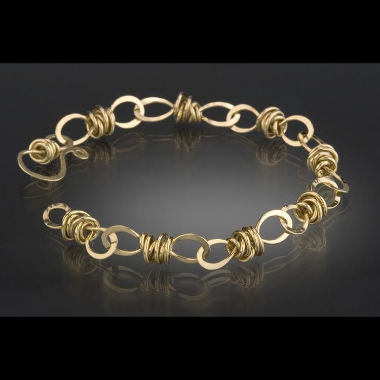 Knot Link Bracelet
Each link of this bracelet is hand fabricated in 18kt. gold,18 gauge round wire.The links are then forged on an anvil to create a reflective surface.
7.5&amp;quot; x .25&amp;quot; x .25&amp;quot;