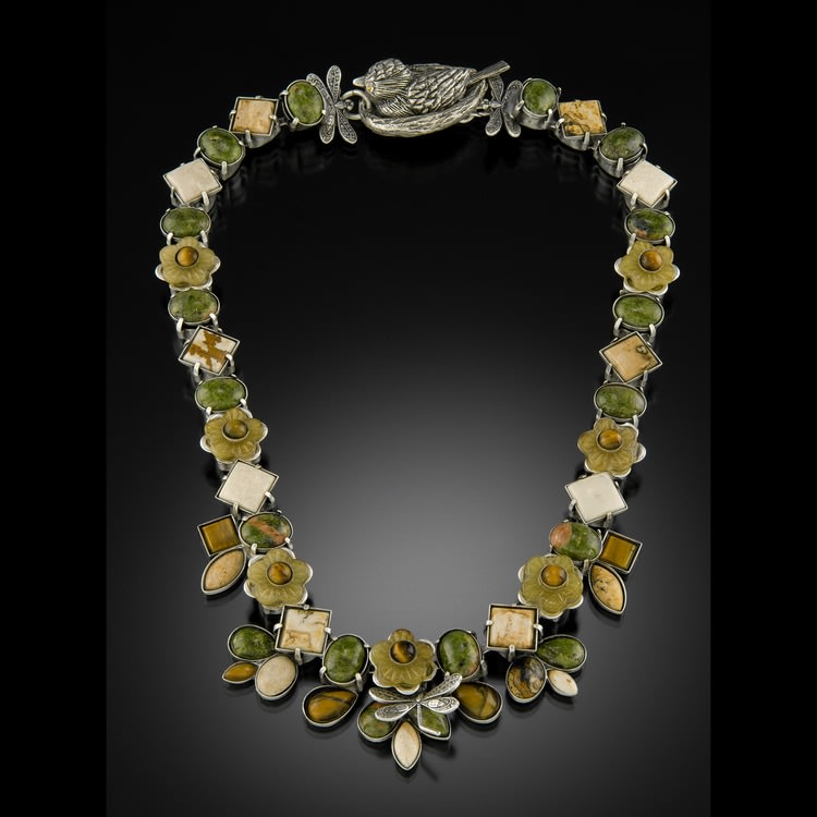 Beige is the new Black
Pewter necklace set with semiprecious stones in autumnal colors of tigers eye, desert jasper, and riverstone, accented with a dragonfly and bird in nest clasp.
1&amp;quot; x 18&amp;quot; x 1&amp;quot;
2019
