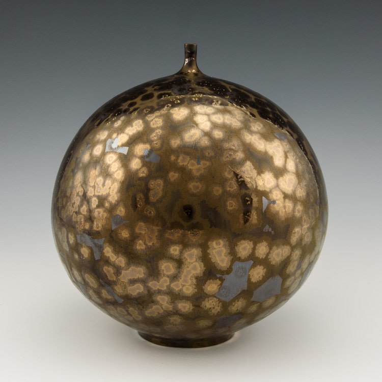 Golden Orb Vase
Wheel thrown vase with metallic crystalline glaze fired to cone 10 in oxidation
8&amp;quot; x 8&amp;quot; x 8&amp;quot;
2019