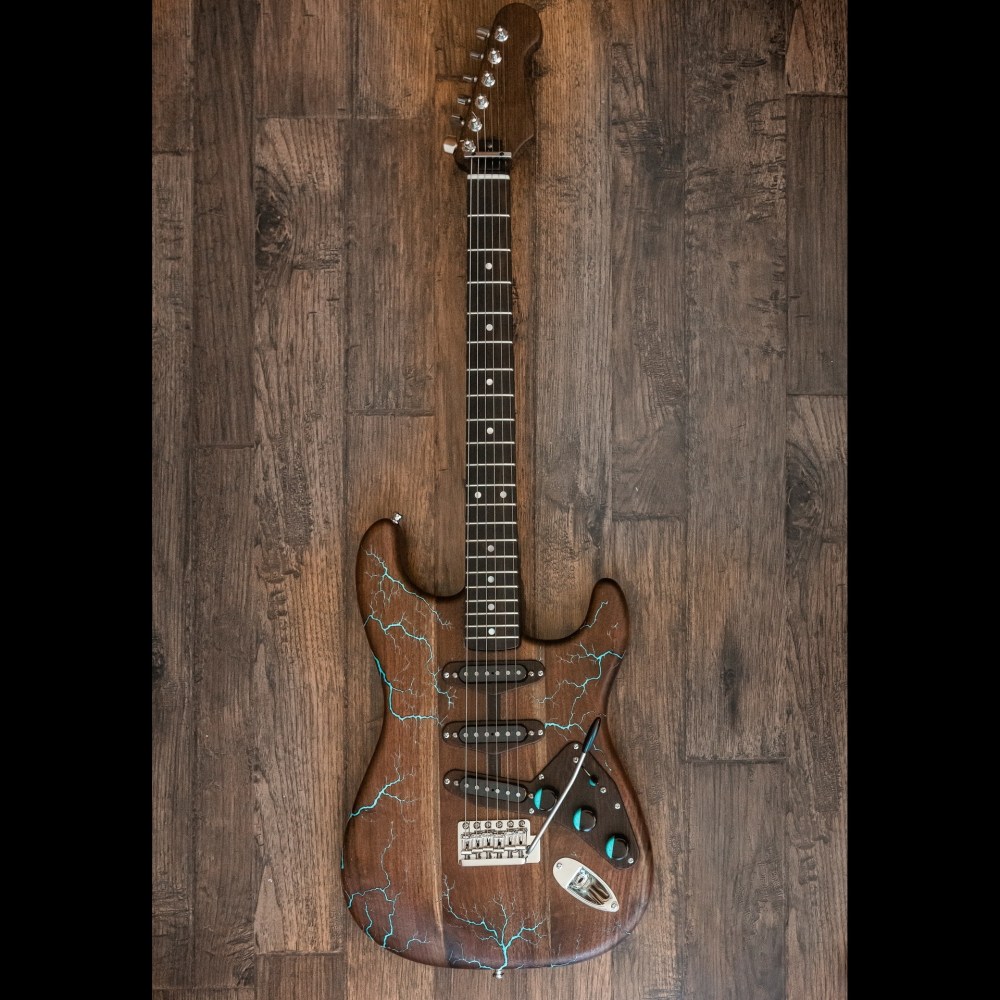 Electrocuted Walnut Electric Guitar with Turquoise Stone Inay

13&amp;quot; x 39&amp;quot; x 2&amp;quot;