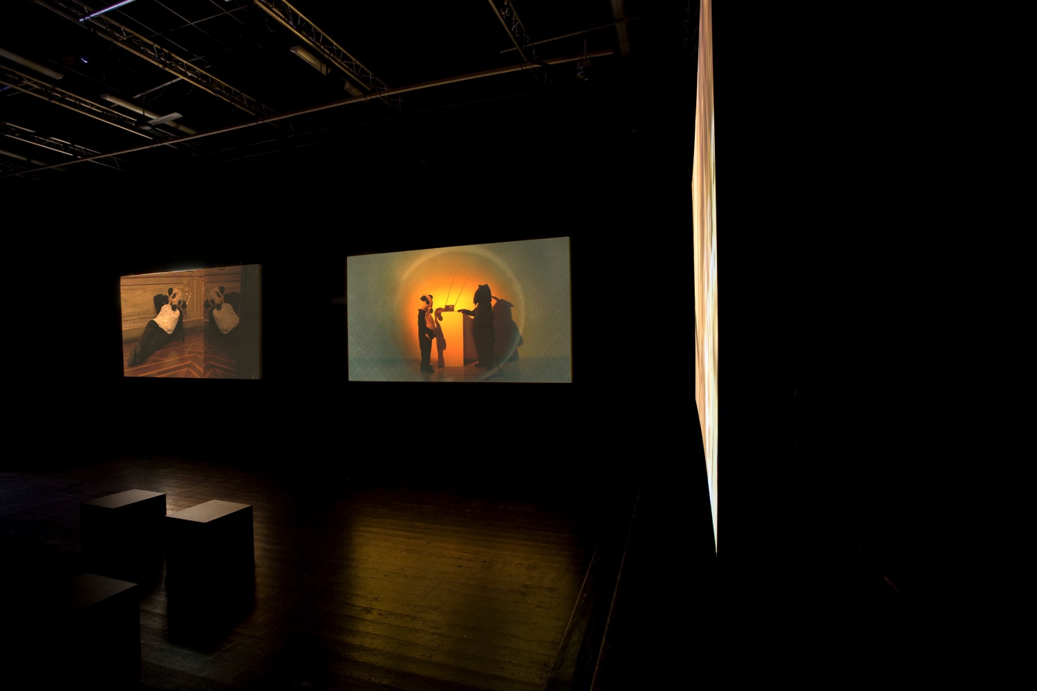 Installation view of video works by Peter Fischli and David Weiss