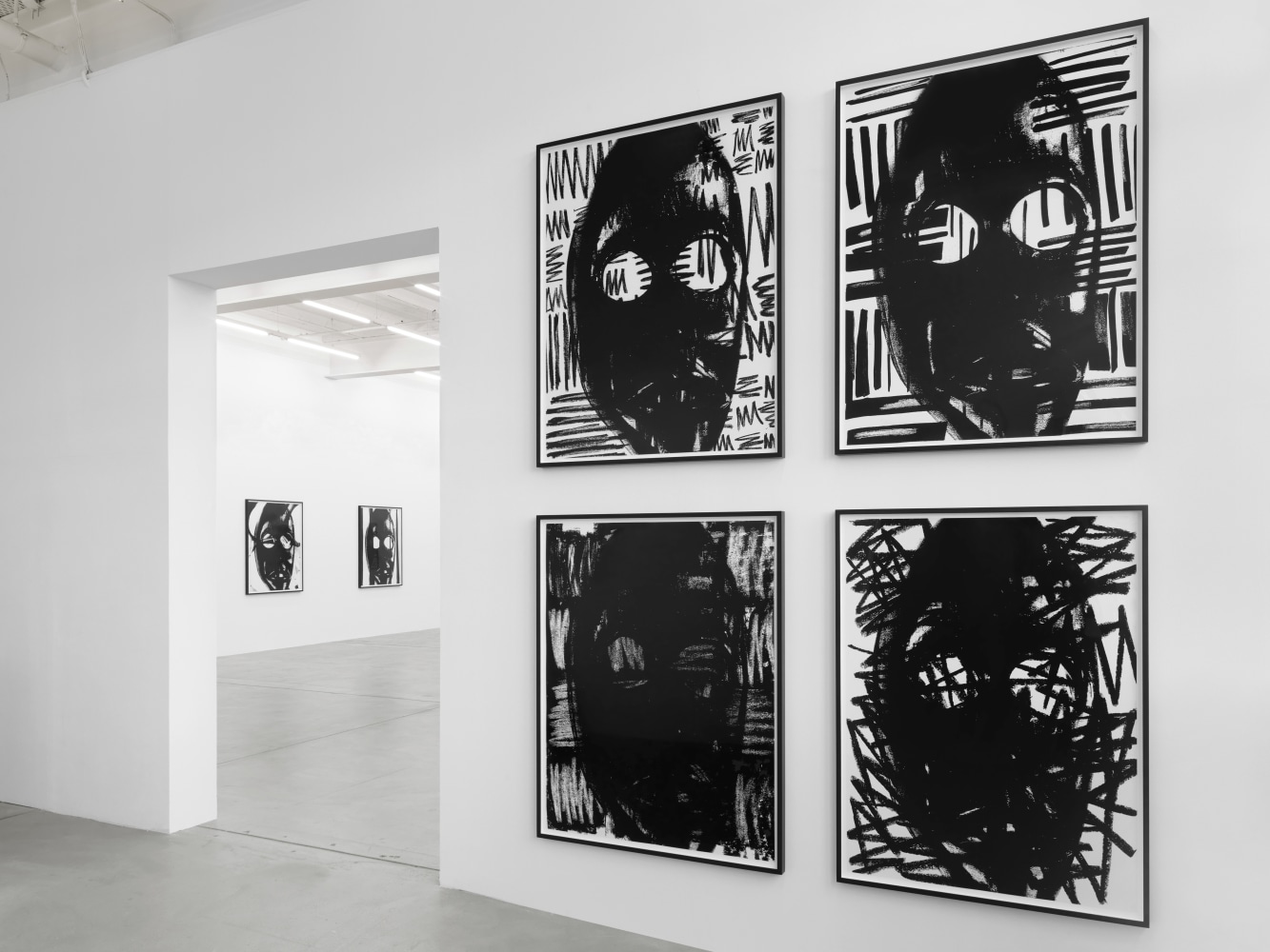 Installation view of Adam Pendleton and Pope.L wall-based works and sculptural installation