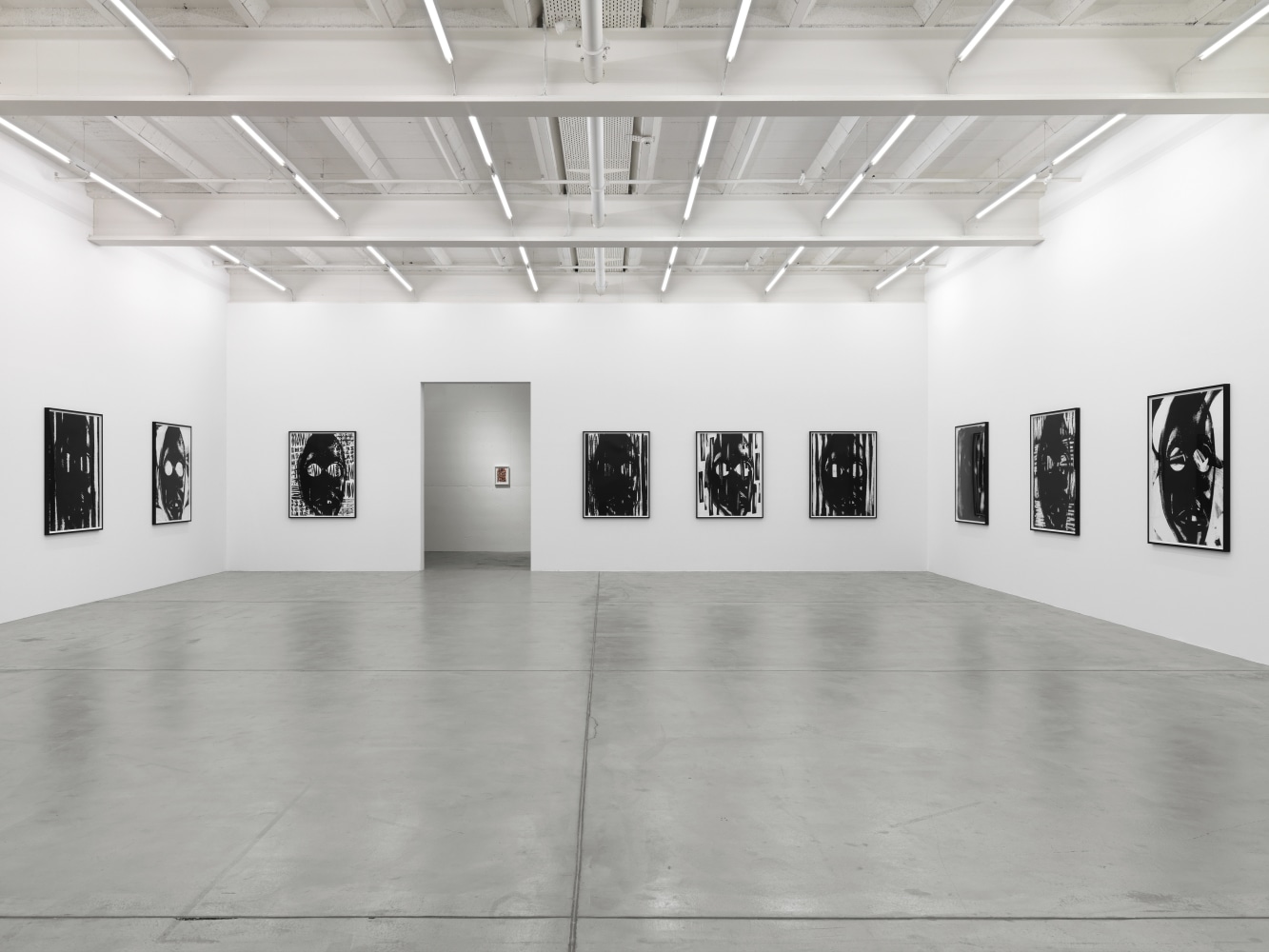 Installation view of Adam Pendleton and Pope.L wall-based works and sculptural installation