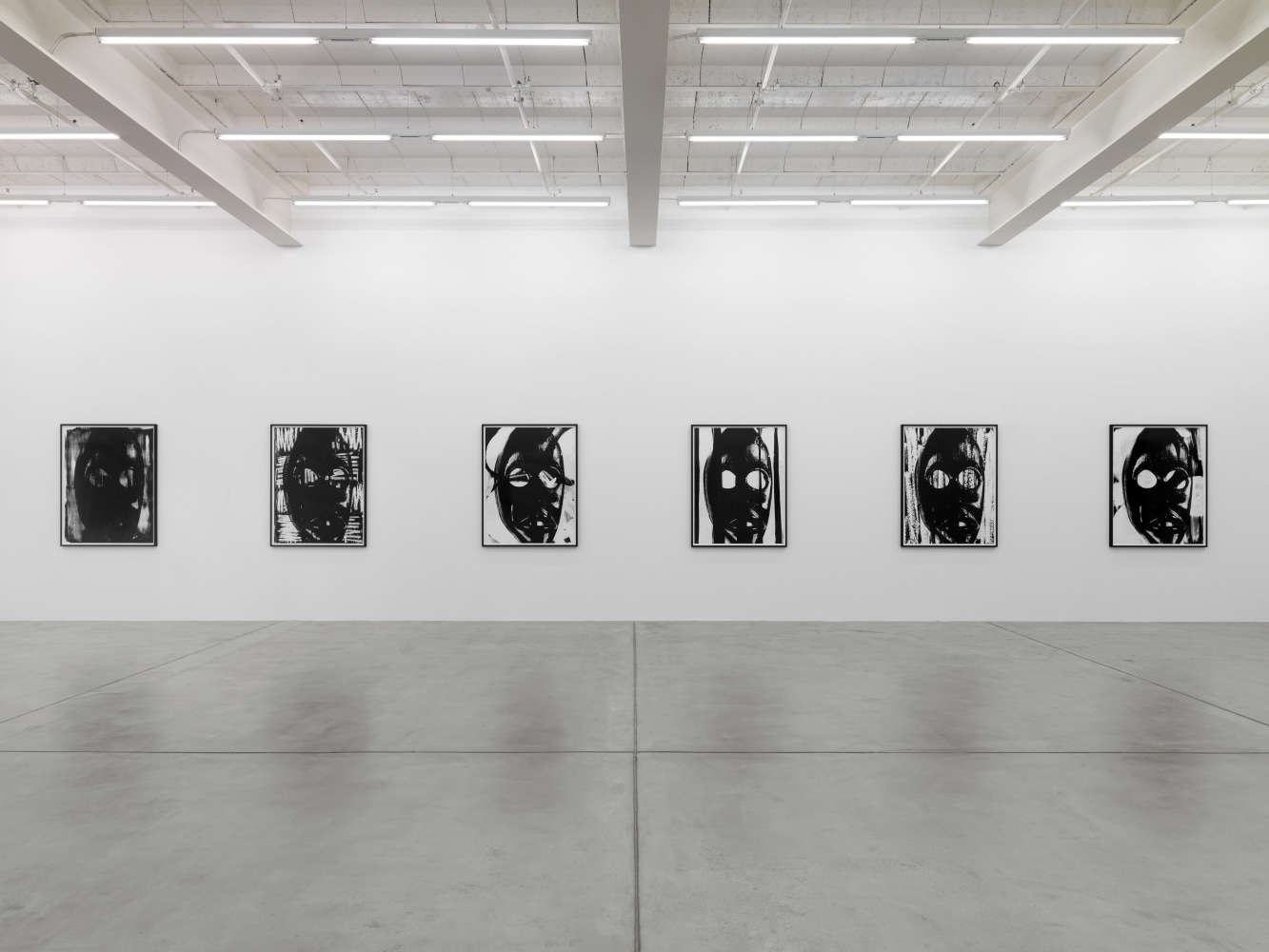 Installation view of Adam Pendleton and Pope.L wall-based works and sculptural installation