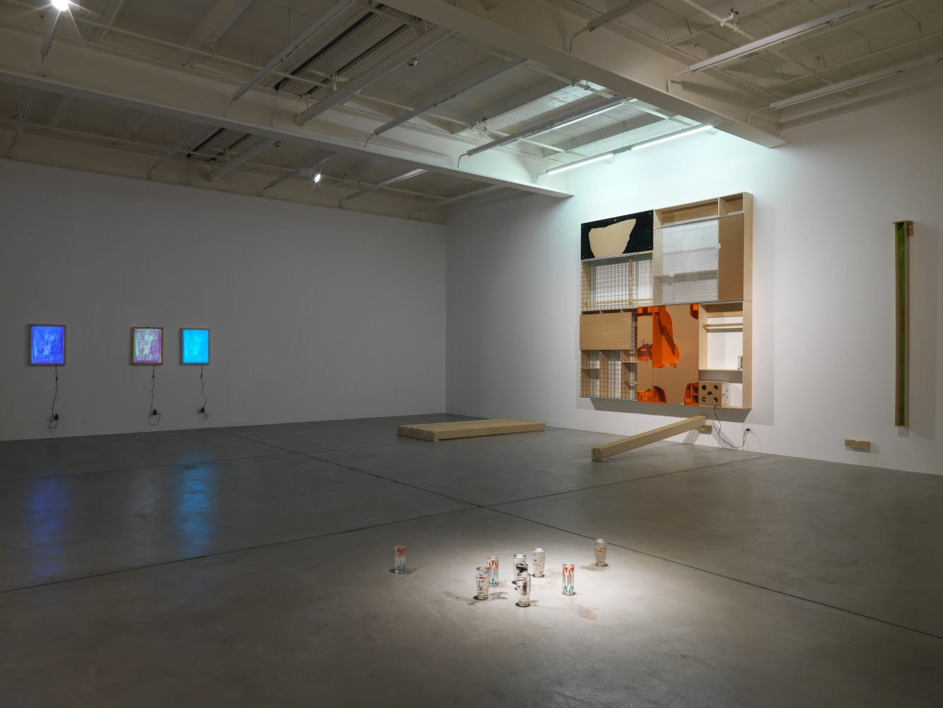 Installation view of Adam Pendleton and Pope.L wall-based works and sculptural installation