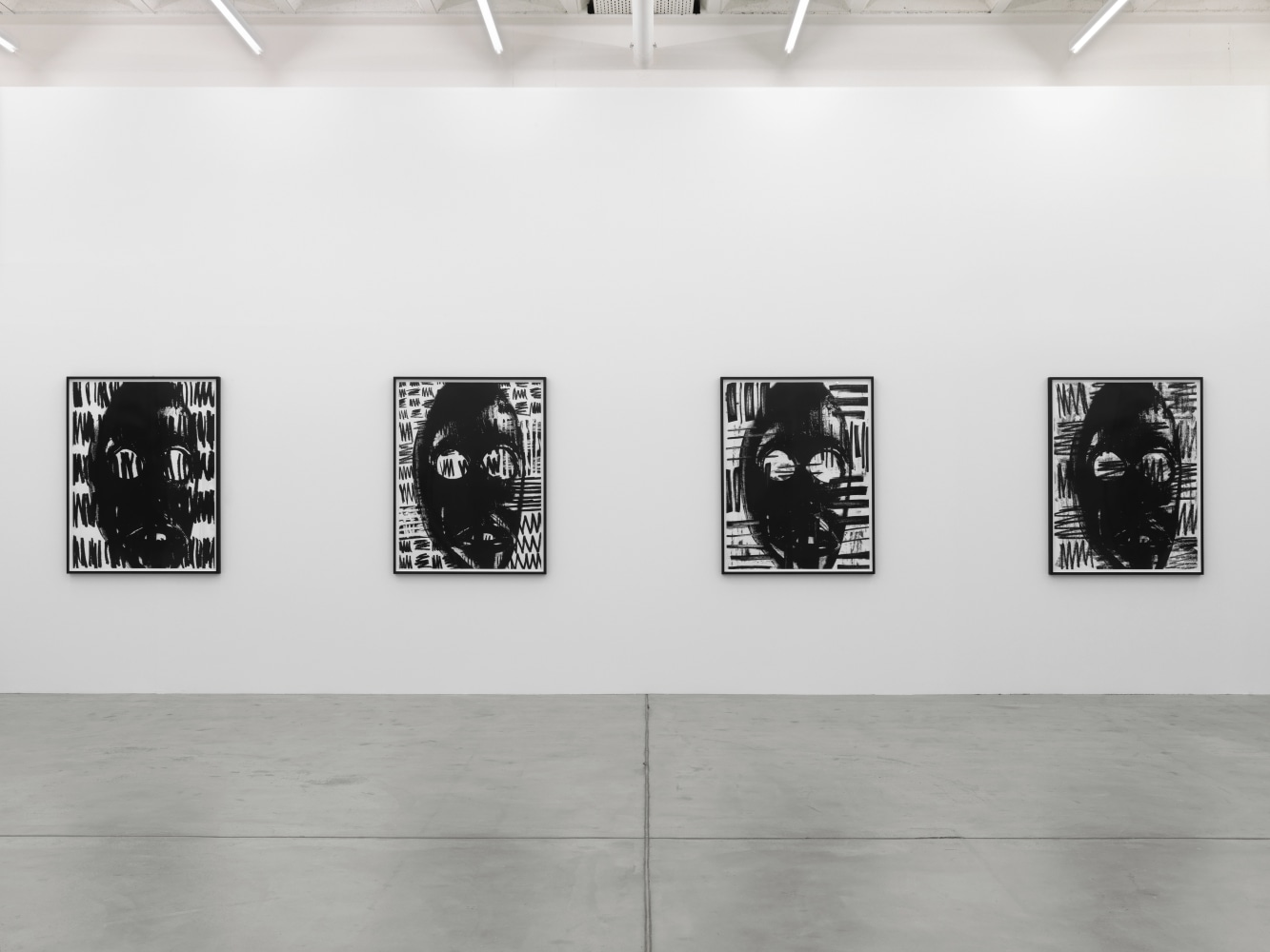 Installation view of Adam Pendleton and Pope.L wall-based works and sculptural installation