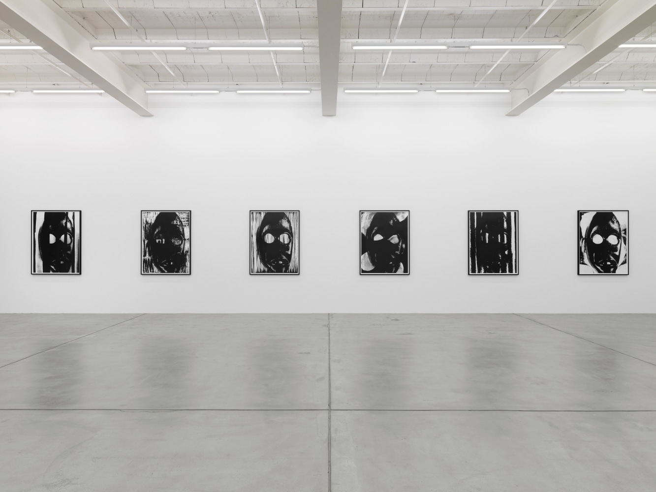 Installation view of Adam Pendleton and Pope.L wall-based works and sculptural installation