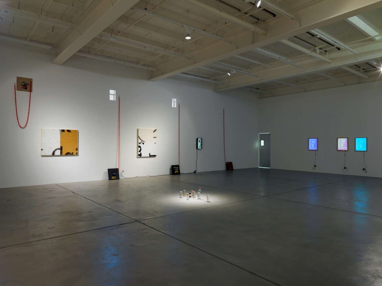 Installation view of Adam Pendleton and Pope.L wall-based works and sculptural installation