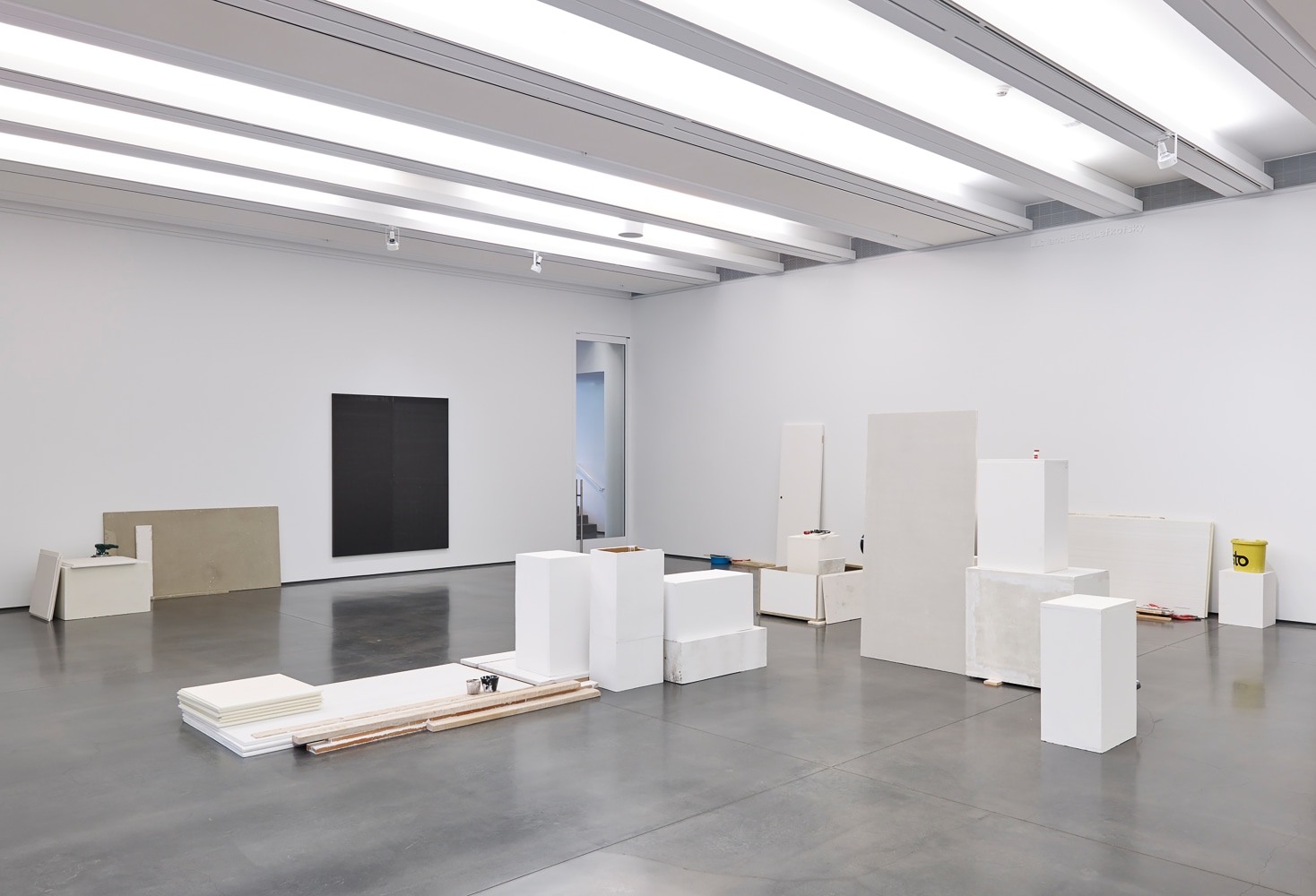 Installation view of sculptures by Peter Fischli and David Weiss and works by Wade Guyton