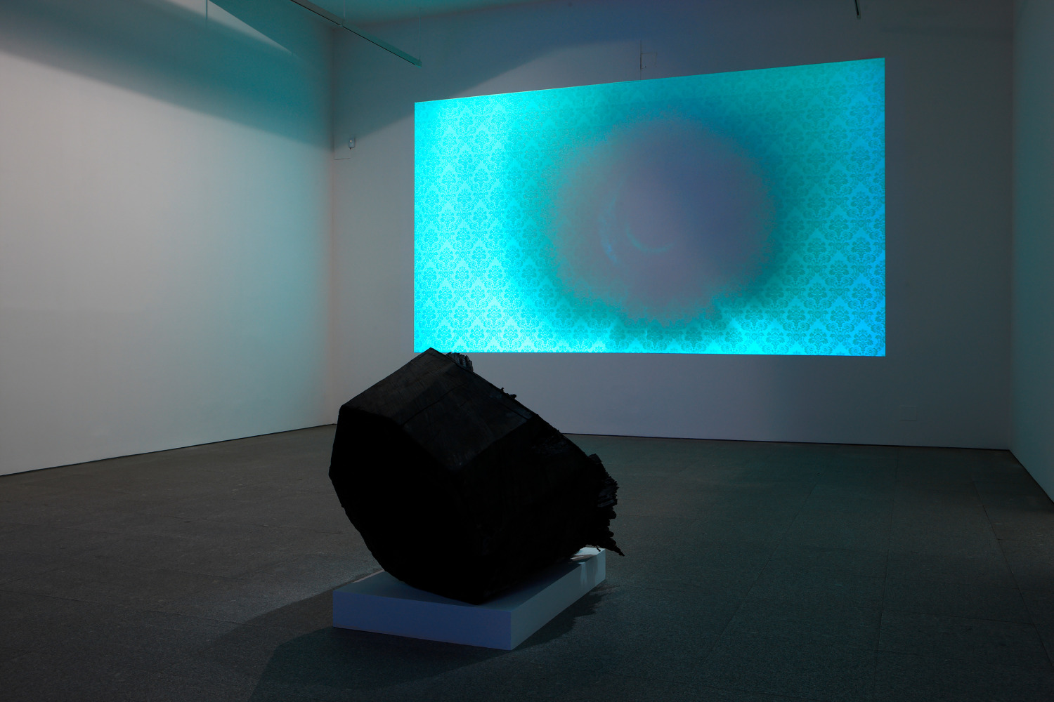 Installation view of sculpture and video work by Peter Fischli and David Weiss