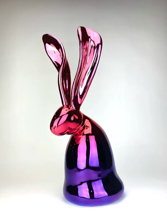 Hunt Slonem’s pink and purple, bunny sculpture, Thompson. Standing at 21.5 inches tall and 8 inches wide. Using one of the oldest artistic mediums, Slonem has cast his iconic bunnies into stunning bronze sculptures in a form that encapsulates the personality of his most famous muse. It is signed and etched with its edition number by Slonem. This hunt slonem bunny sculpture and hunt slonem bunny paintings are for sale at Manolis Projects Art Gallery in Miami, FL.