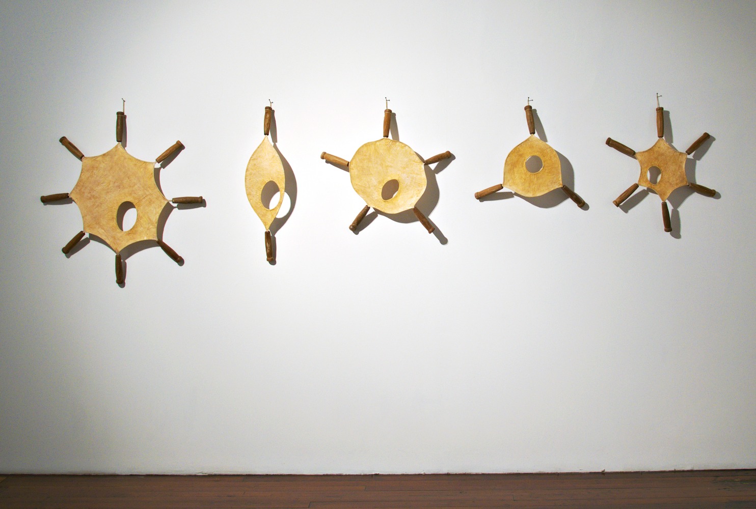 Drumbeats, 2009
Stainless steel, muslin, tamarind kernel, wood, and lacquer
36" x 135" x 4 1/2"